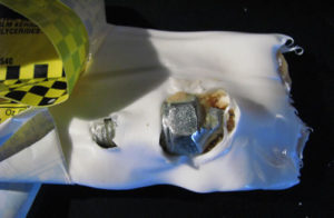 Abba Zaba candy bar with a metal nut and bolt inside